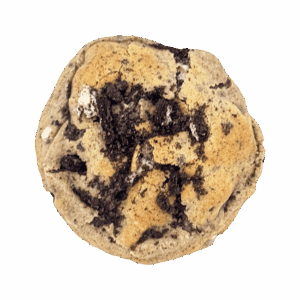 Close-up top view of a homemade cookies and cream cookie with crushed sandwich cookies and white chocolate chips.